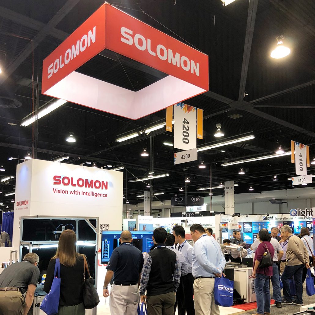 visitors gathered around Solomon's booth at ATX West