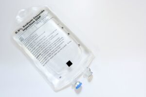 transparent IV bag on a clear background