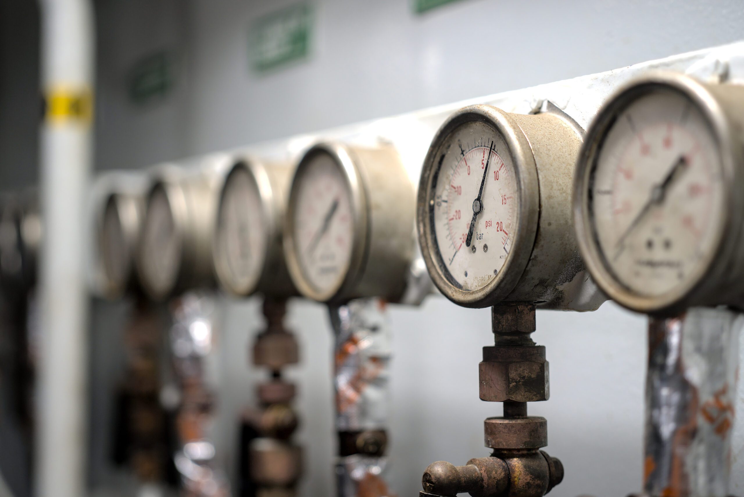 Pressure gauge psi meter in pipe and valves of water, oil and gas system industry