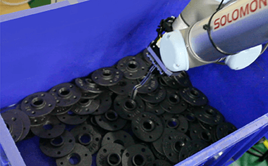 Bin Picking black metal objects are picking from a blue bin using a UR robot arm
