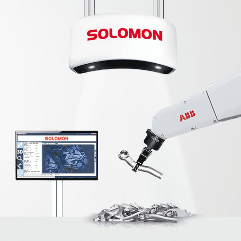 Solomon AccuPick 3D deep learning software integrated with robotic arm picking defective metal object from pile of similar metal objects
