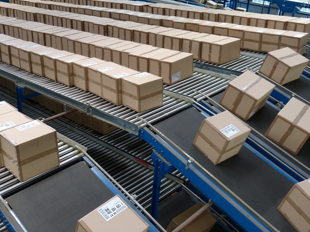 cardboard boxes on a conveyor in a distribution center