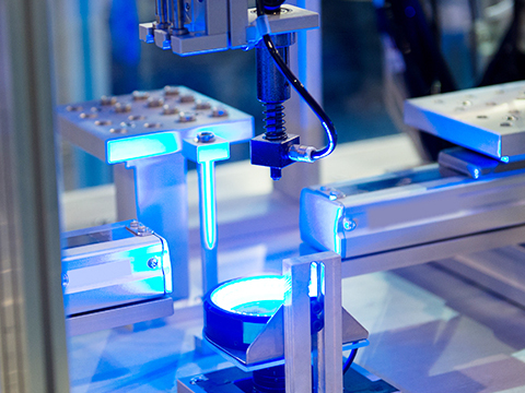 an optoelectronics machine with a blue light inside of it