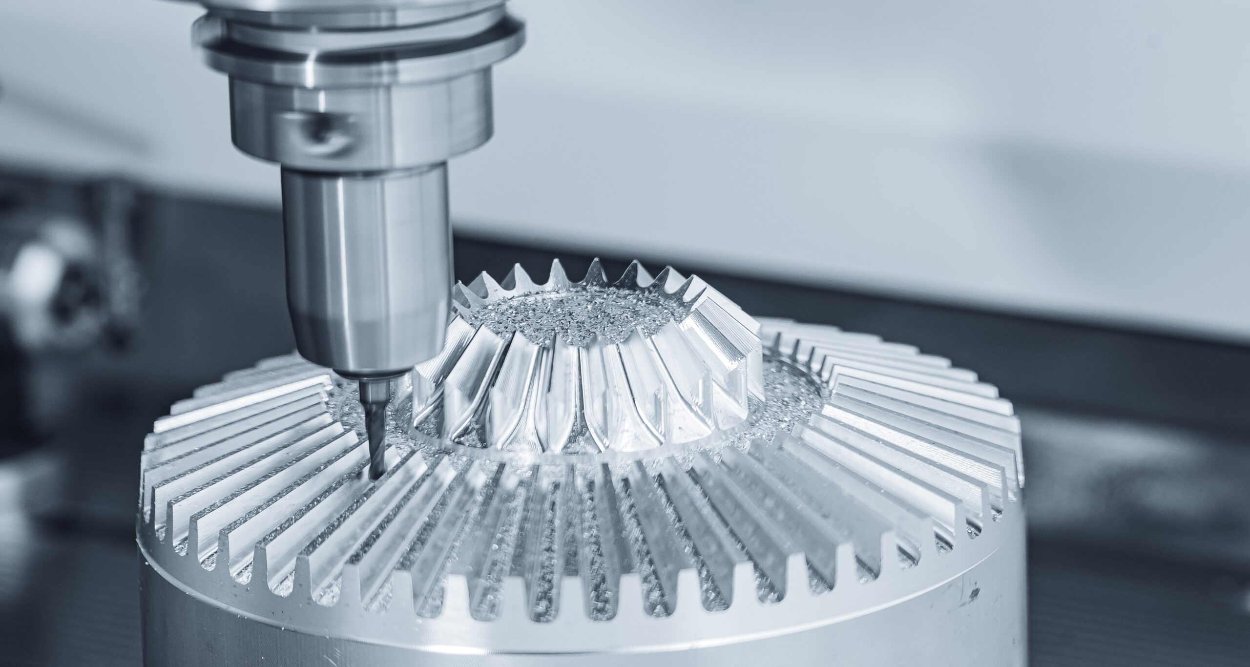 A close-up of a high-precision CNC (Computer Numerical Control) machine cutting a complex, gear-like metal component, with metal shavings visible. This highlights the application of AI vision and vision guided robotics in metal processing for ensuring dimensional accuracy, surface quality inspection, and automated defect detection during milling and fabrication