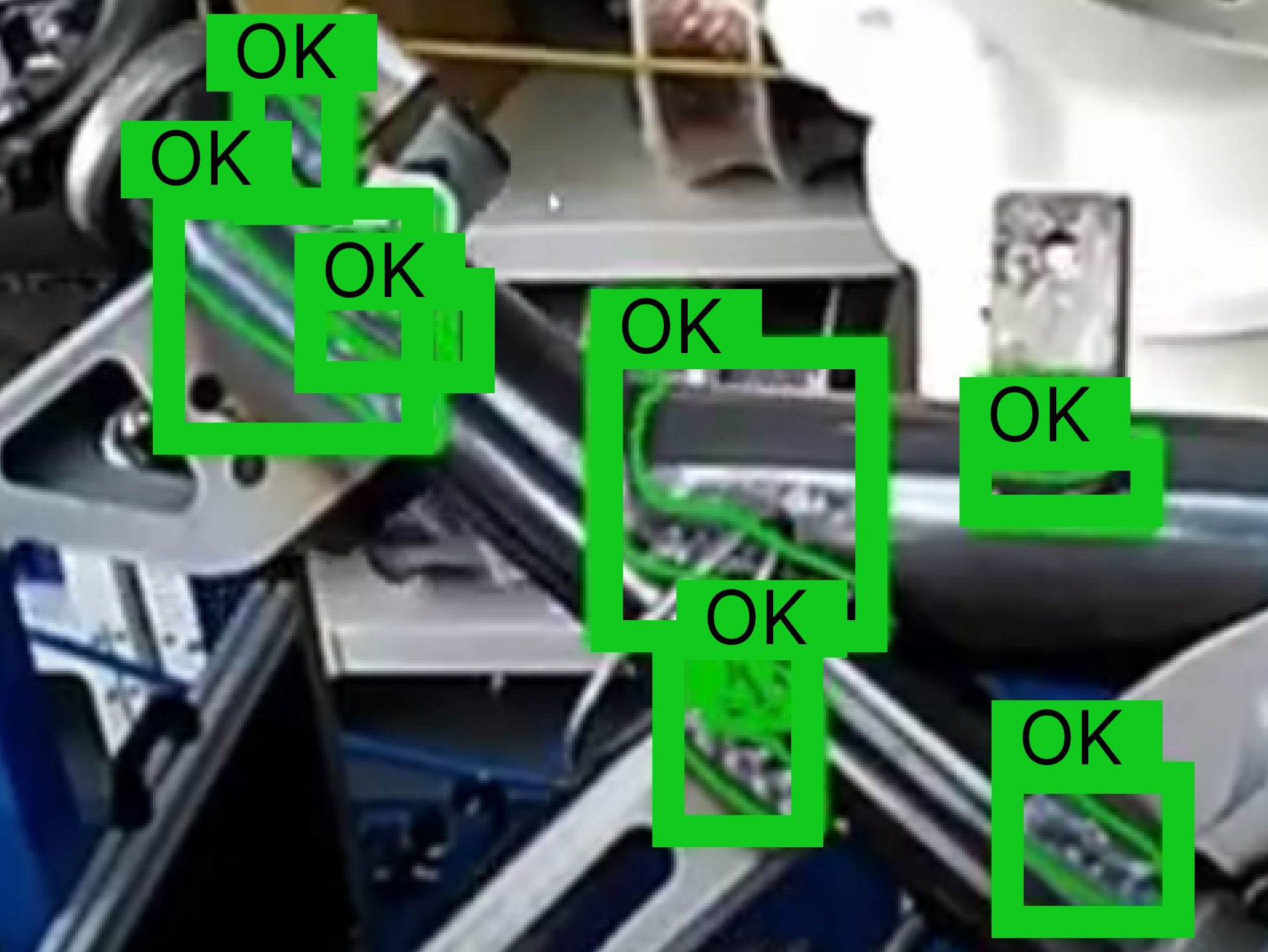 META-aivi AR + AI vision system performing quality inspection on a welded metal frame, showing green bounding boxes and 'OK' labels indicating successful part verification and assembly checks.