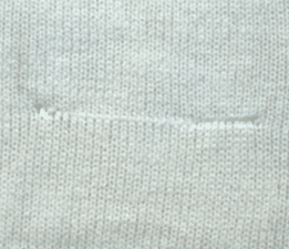 Needle mark defective socks