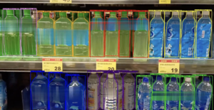 META-aivi detects sports drink bottles on a supermarket shelf with AI bounding boxes for planogram compliance verification.