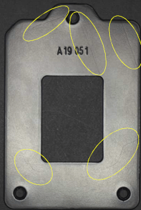 Minor Scratches and Blemishes on a Metal Casing An image of a metal casing with minor scratches and surface blemishes circled in yellow, showcasing the AI vision system's ability to classify defects.