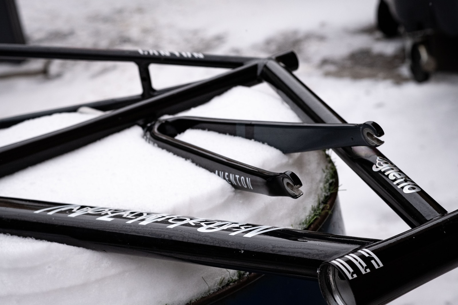 a close up of a bike frame in the snow
