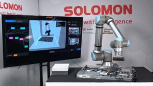 A UR cobot powered by Solomon AI, UR AI Accelerator and NVIDIA Isaac technology performing visual inspection of components on a computer server board in a robotics lab