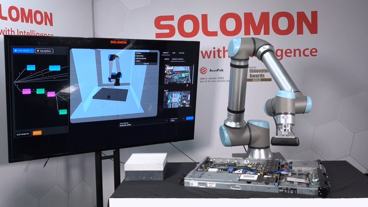 A UR cobot powered by Solomon AI, UR AI Accelerator and NVIDIA Isaac technology performing visual inspection of components on a computer server board in a robotics lab