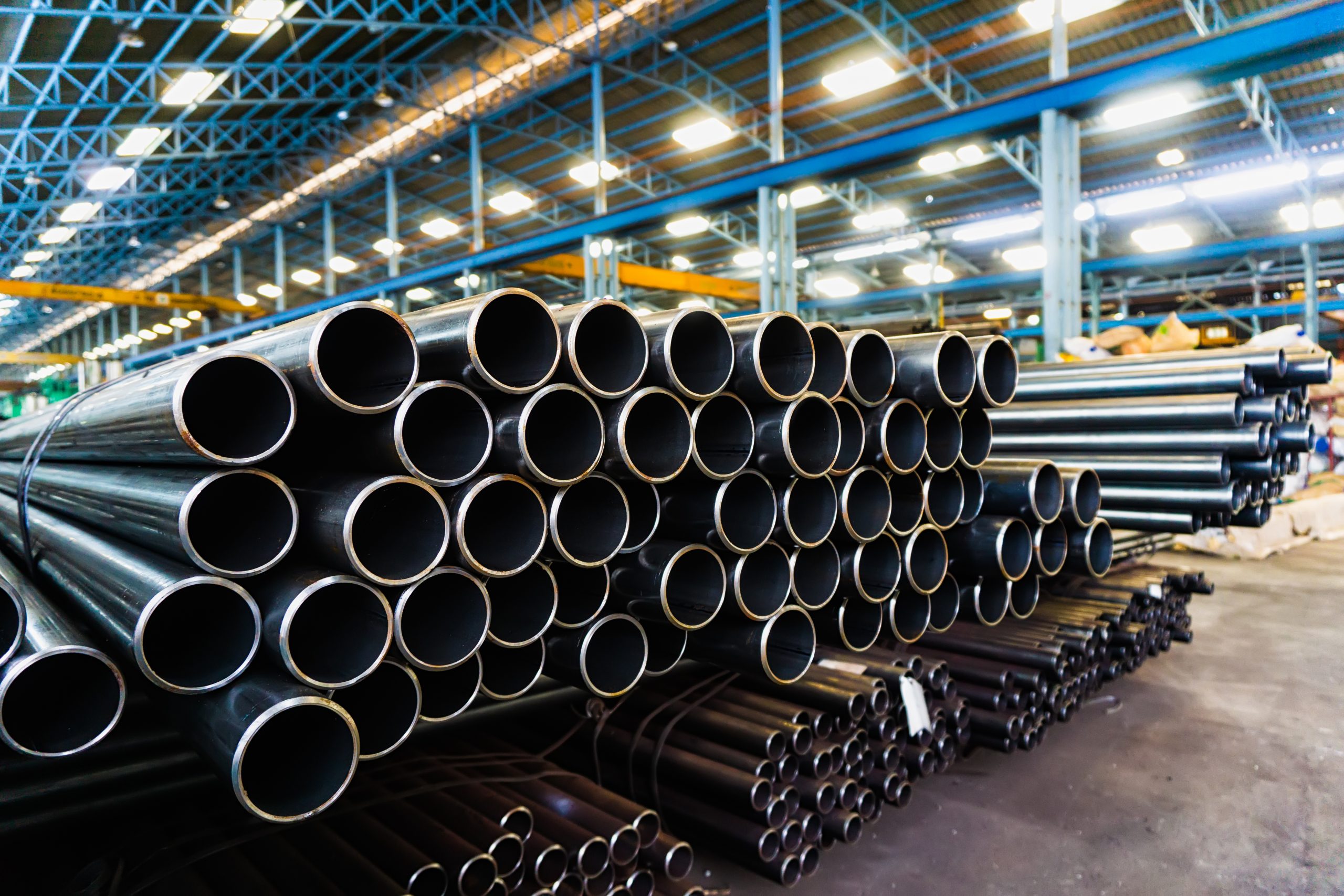 high quality Galvanized steel pipe or Aluminum and chrome stainless pipes in stack waiting for shipment  in warehouse