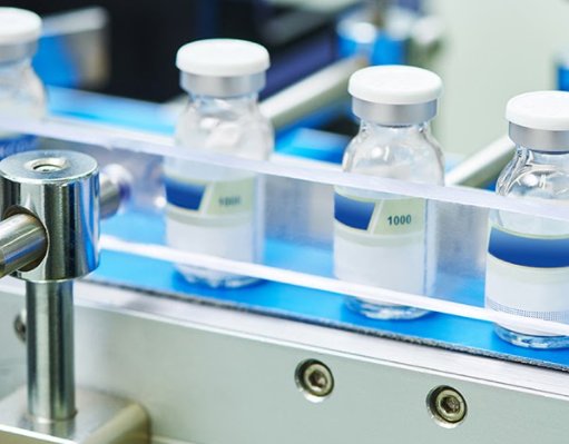 Automated pharmaceutical vial inspection detecting defects using SolVision AI vision system.