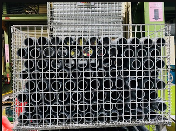 steel pipes stacked in a basket